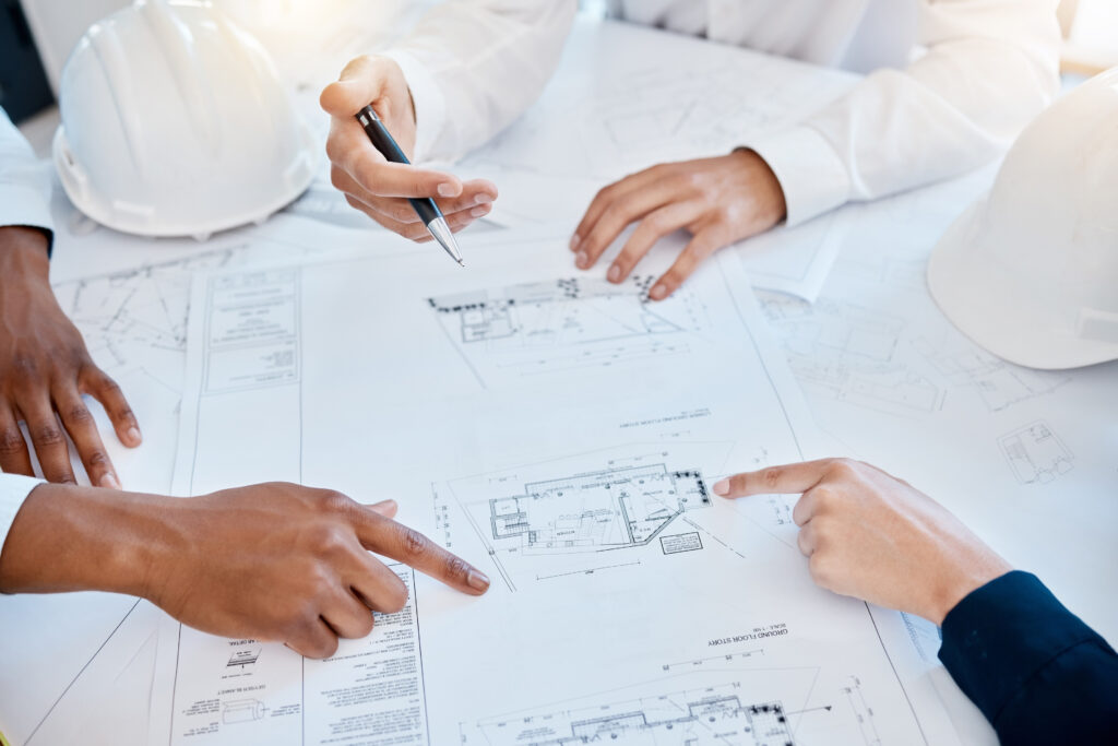 architecture blueprint engineering team pointing planning discussing construction development project with floor plan collaboration with engineers architects working 3d design
