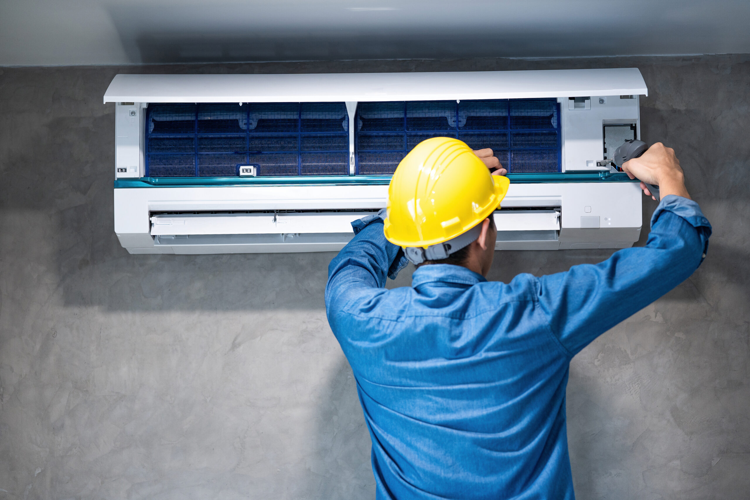 technician man repairing cleaning maintenance air conditioner